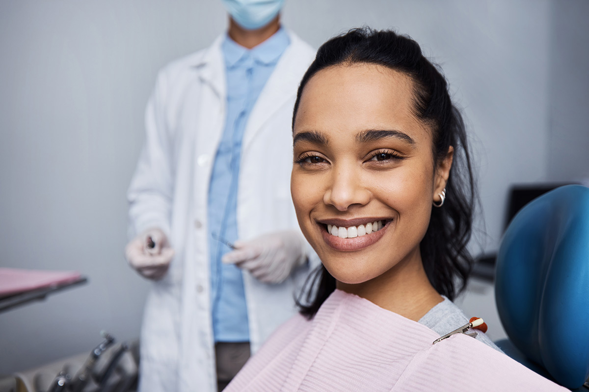 Smiling patient seated for a dental visit