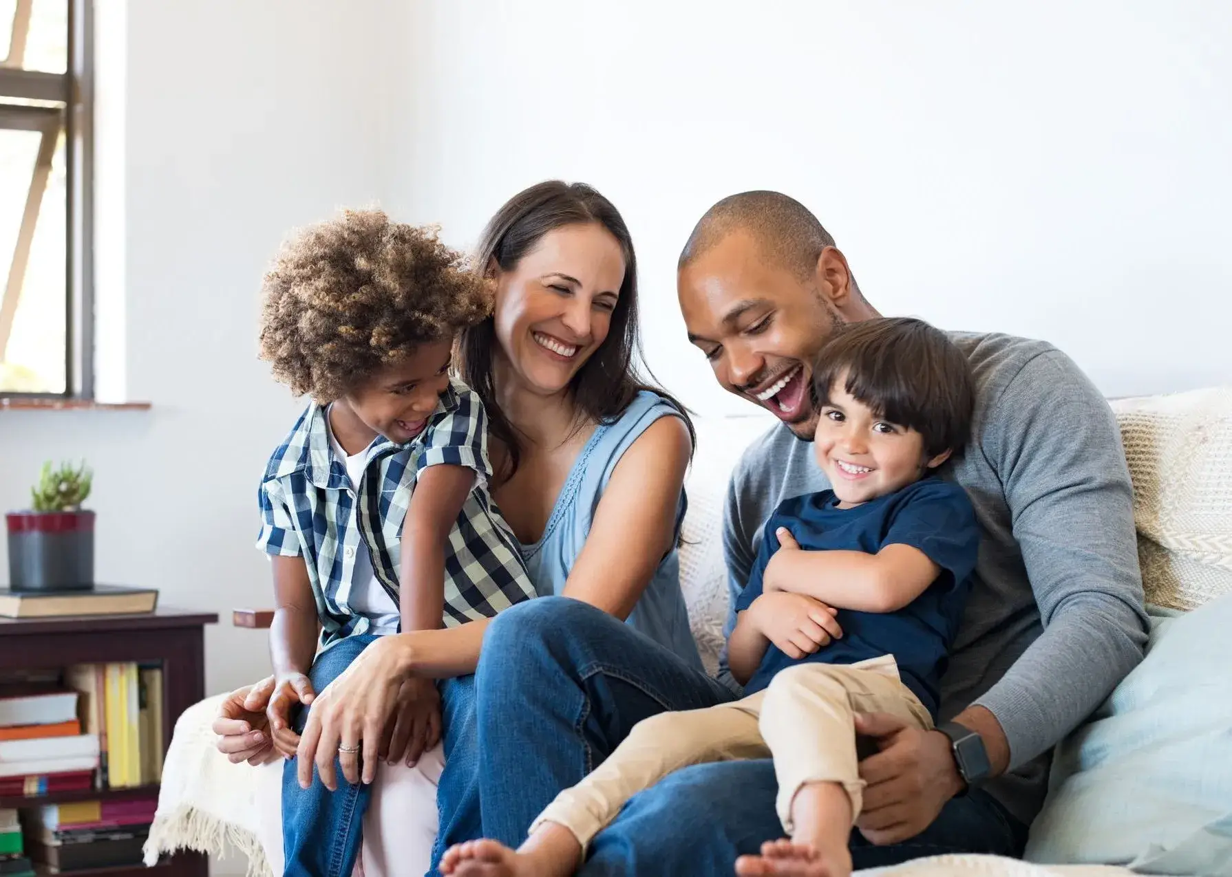 Family smiling together at home